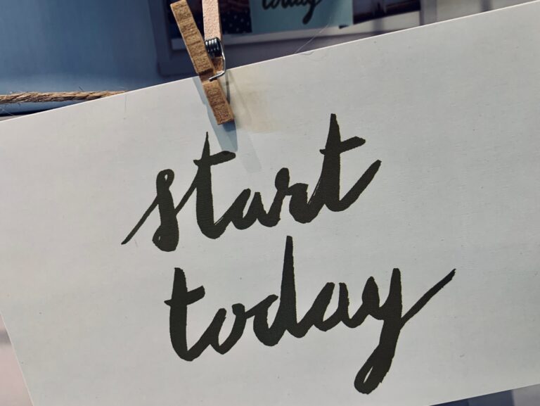 A sign reading start today new beginnings